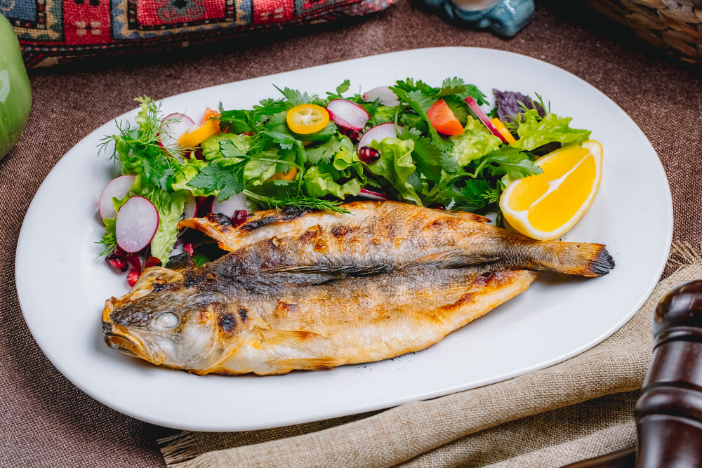 front-view-grilled-fish-with-salad-vegetables-herbs-with-slice-lemon